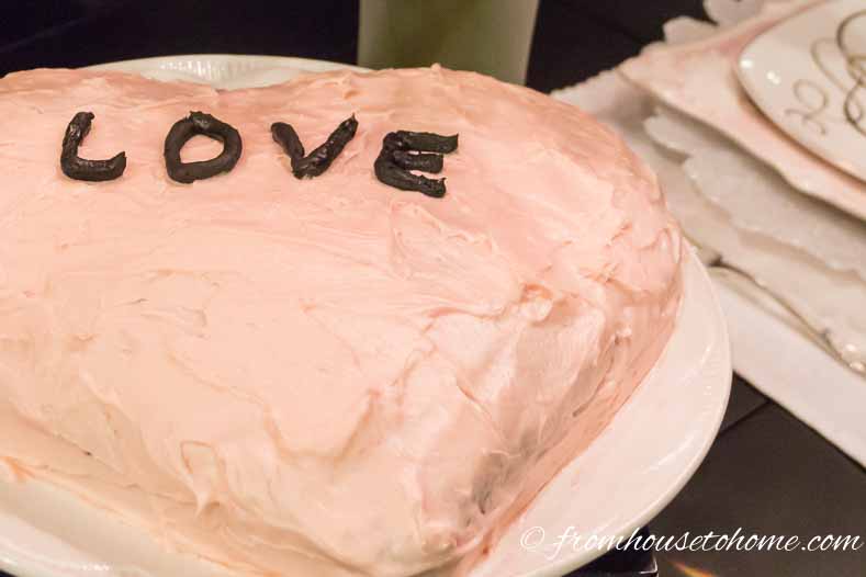 Cream cheese icing with a little red food coloring makes the perfect Valentine's Day heart-shaped cake