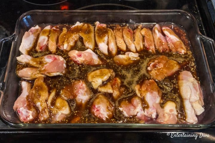 Easy baked sticky Chinese chicken wings in the pan with brown sugar and soy sauce before baking