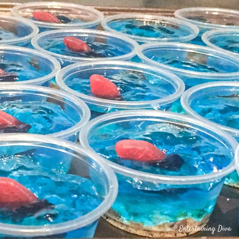 Blue Jello shots with Swedish fish jellies in them