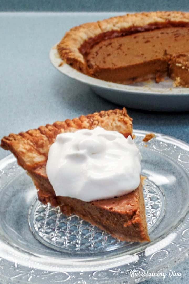 Pumpkin pie slice with whipped cream