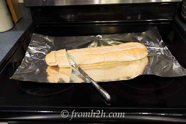 Slice the french loaf into 2" sections and butter both sides of each piece of garlic bread