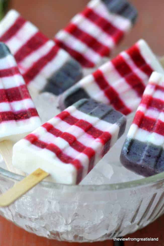 Red, white and blueberry yogurt popsicles (via theviewfromgreatisland.com)