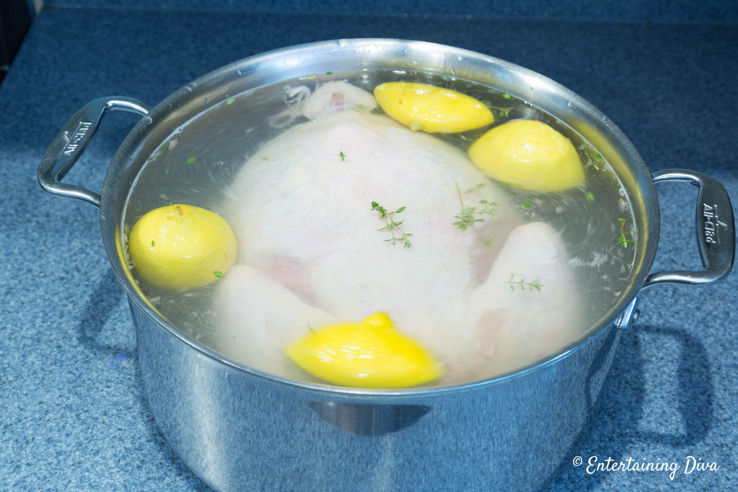 Chicken being brined in a large pot