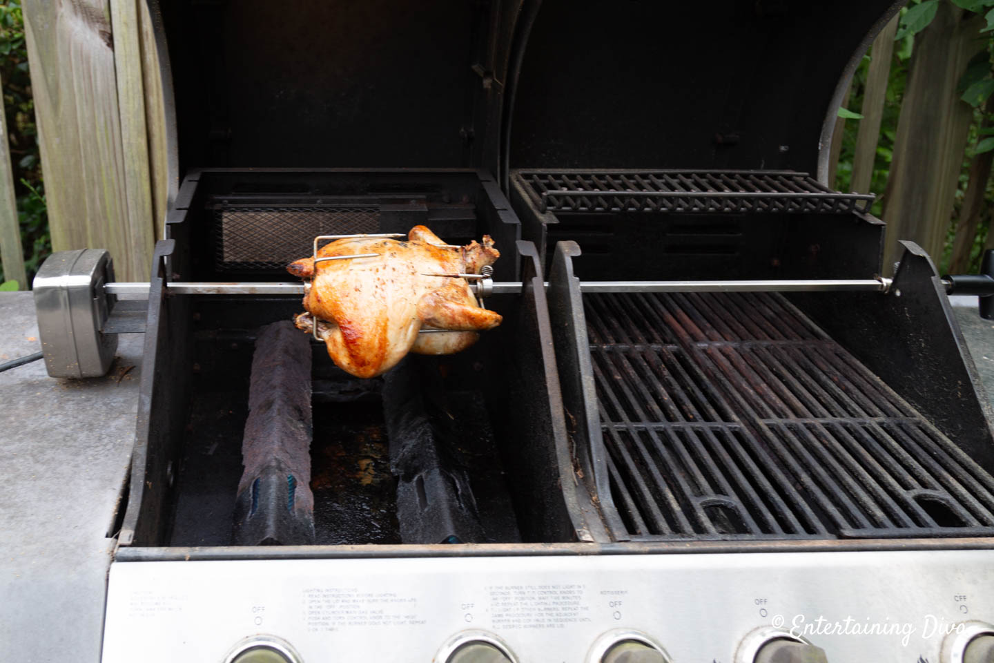 Rotisserie chicken on a spit in the grill