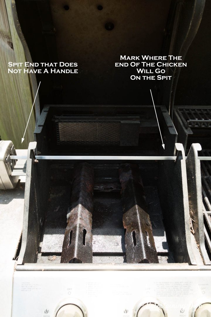 Figure out where the end of the chicken will go on the spit