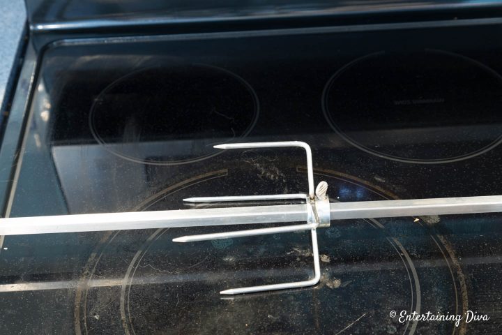 Rotisserie fork installed on a spit