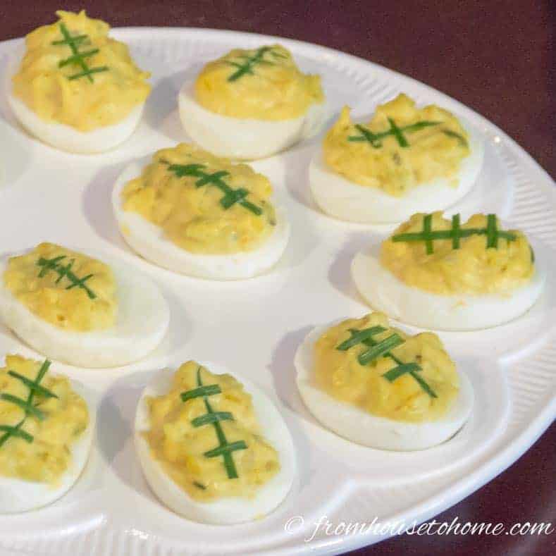 Make your devilled eggs look like footballs by adding green onion laces