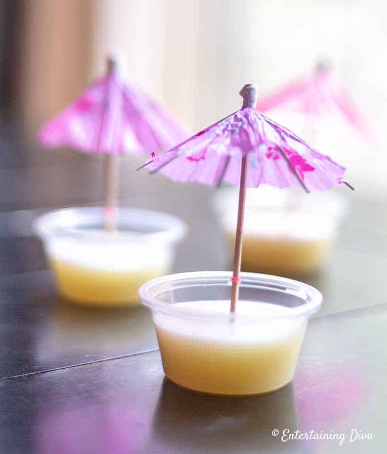 These white Pina Colada jello shots (made with coconut milk, pineapple juic...