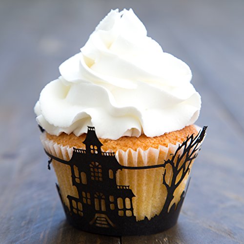 cupcake with white frosting and a haunted house cupcake liner