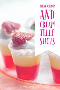 strawberries and cream jello shots with whipped cream garnish
