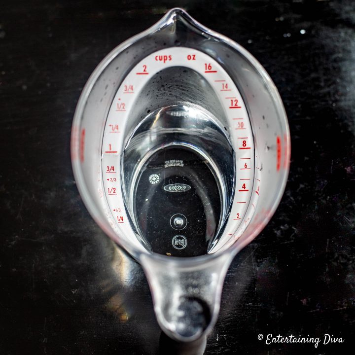Measuring cup with cold jello shot ingredients