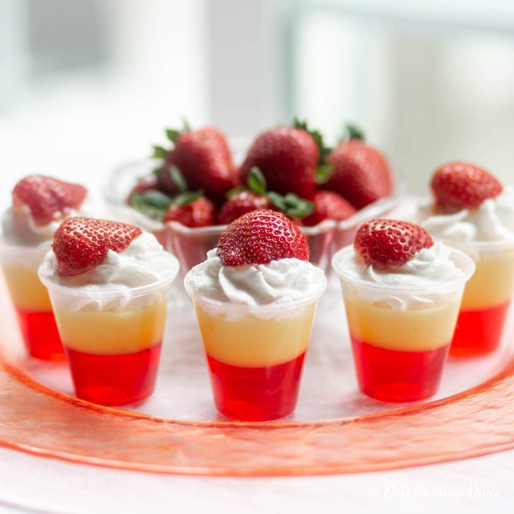 Strawberries and cream jello shots recipe with whipped cream and strawberries