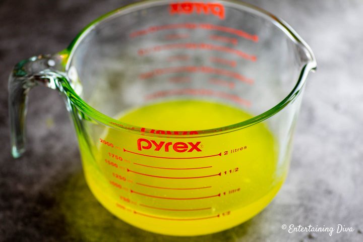 The yellow mixed jello for the second layer of the Mardi Gras Jello shots recipe