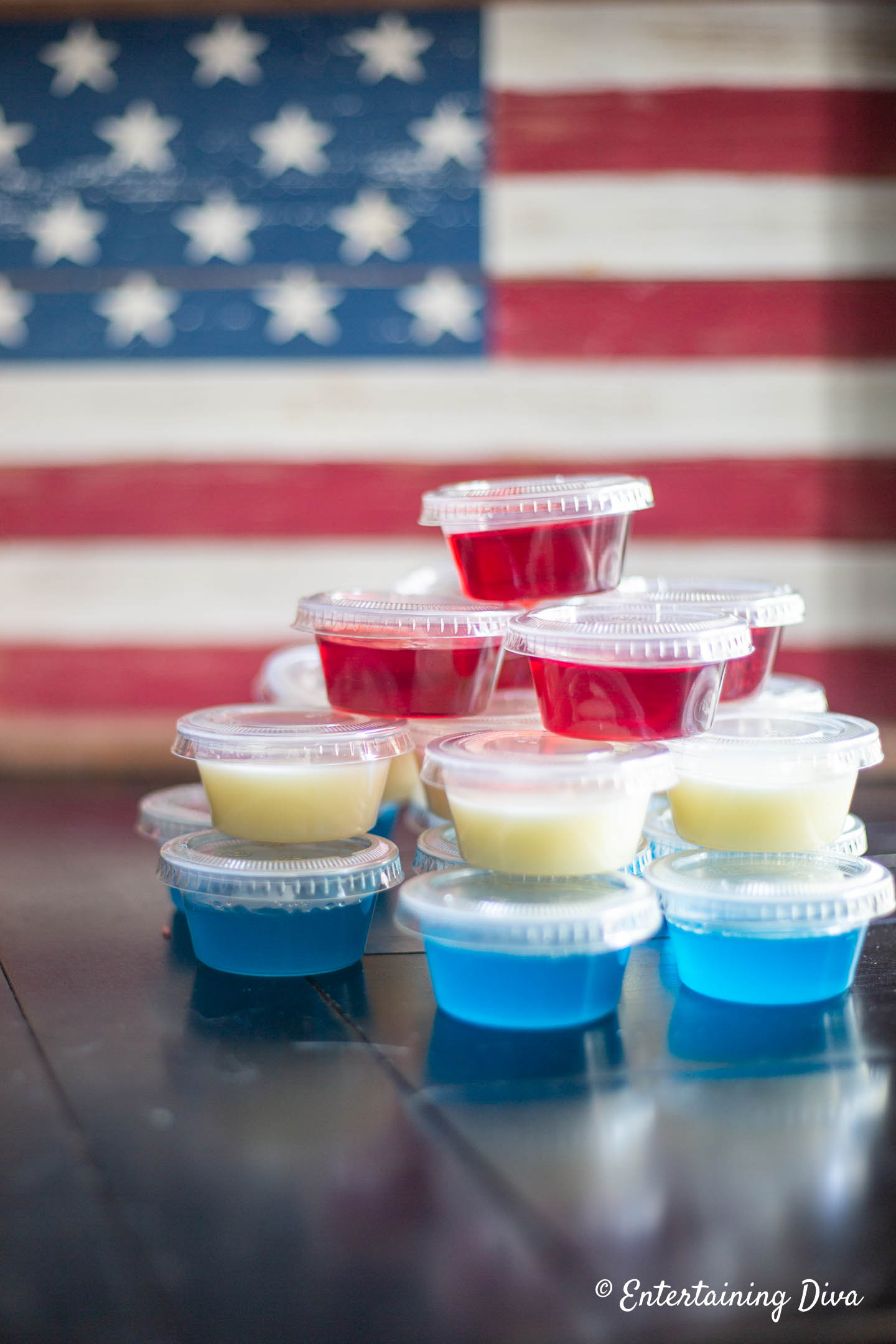 a stack of red, white and blue jello shots