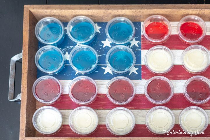 red, white and blue jello shots displayed on an American flag tray