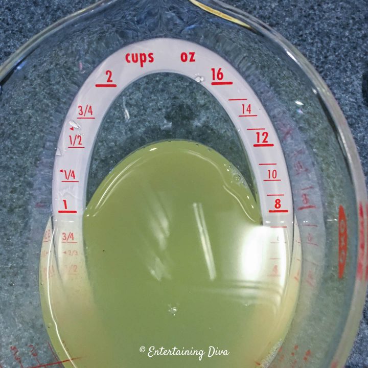 Lemon drop jello shots cold liquid ingredients in a measuring cup