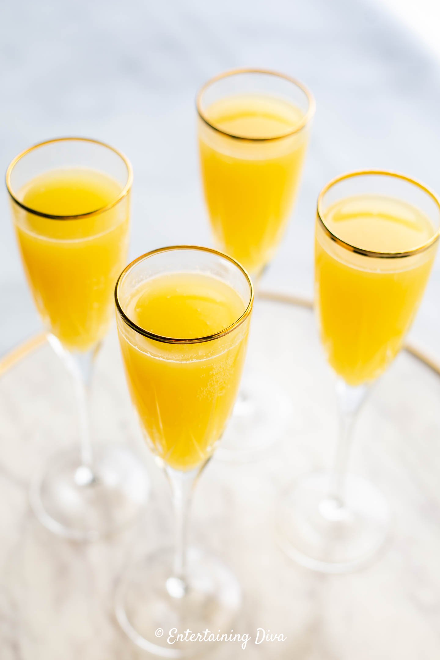 Classic mimosa recipe in champagne flute glasses
