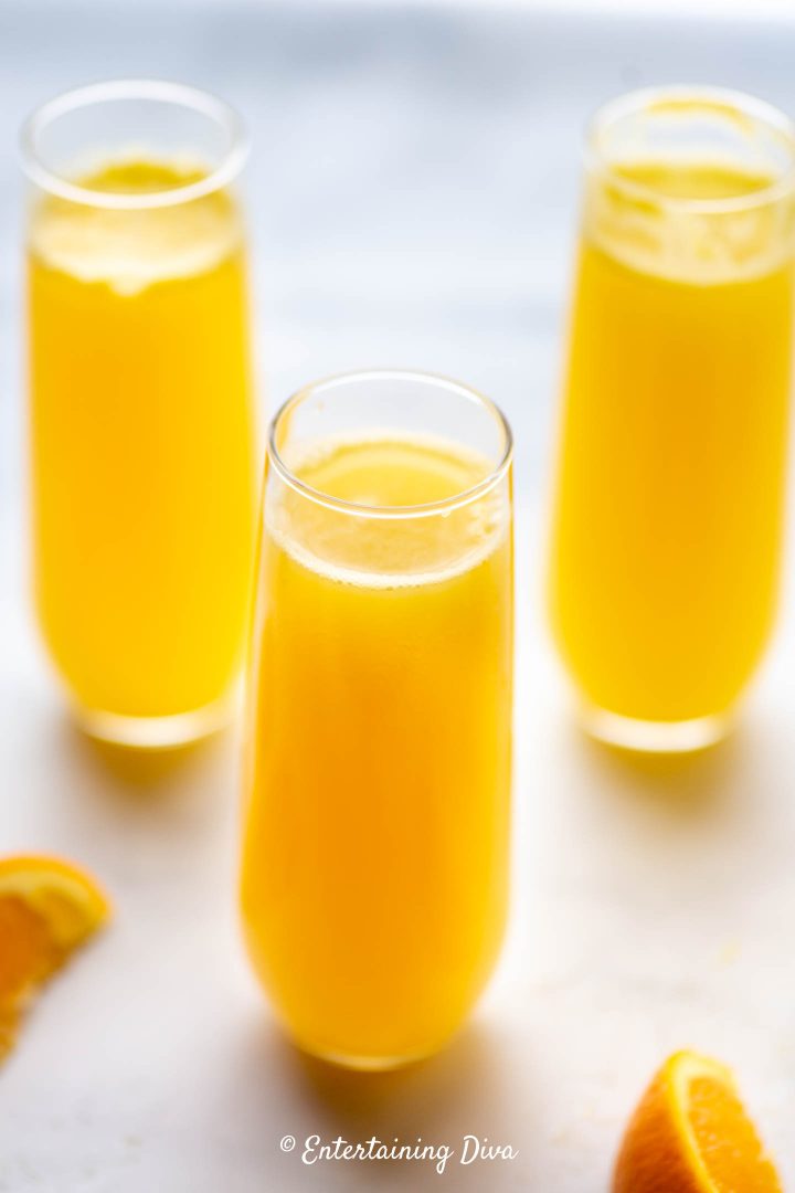 Classic mimosas in stemless flute glasses