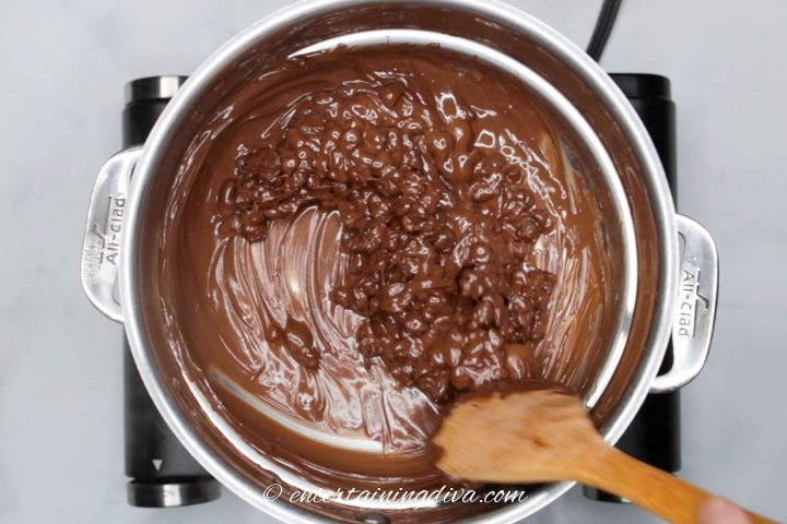 Semi-sweet chocolate chips being melted on the stove