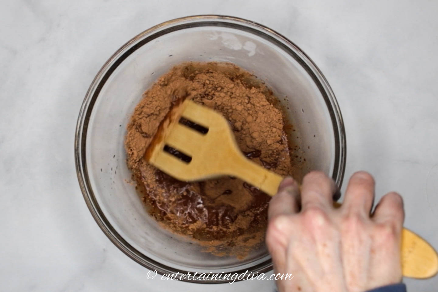Cocoa powder being mixed with water