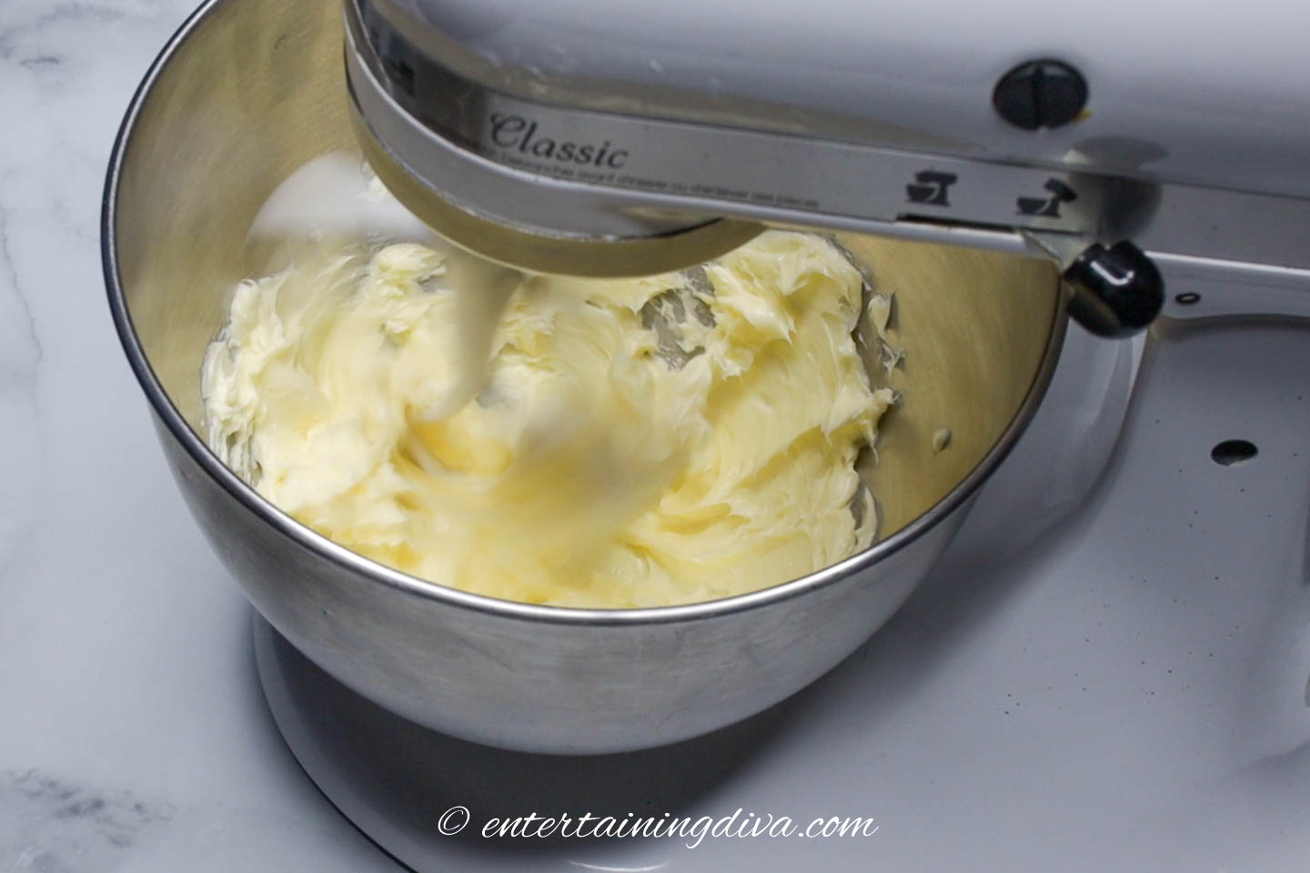 Butter being creamed by an electric mixer