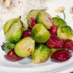 red and green brussel sprouts with cherries