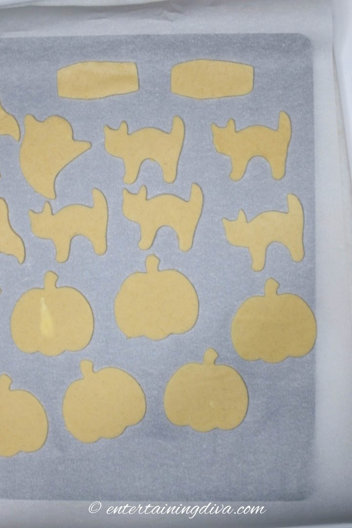 Cat cookie cut-outs on a cookie sheet
