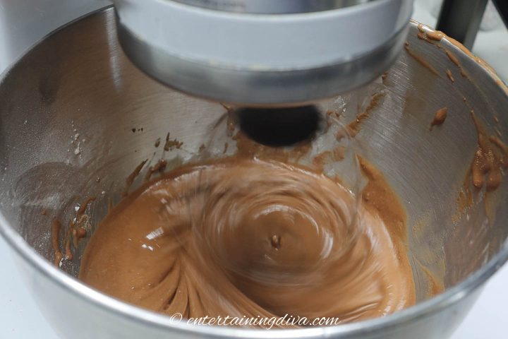royal icing with cocoa powder being mixed