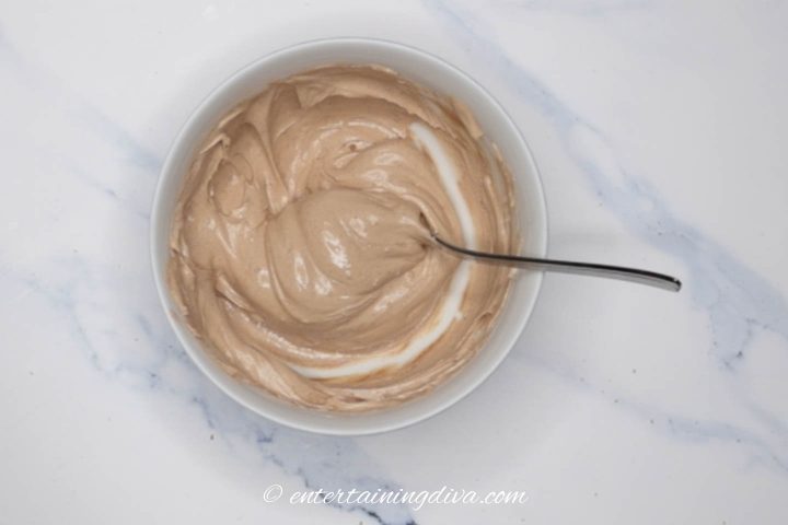 brown royal icing in a bowl
