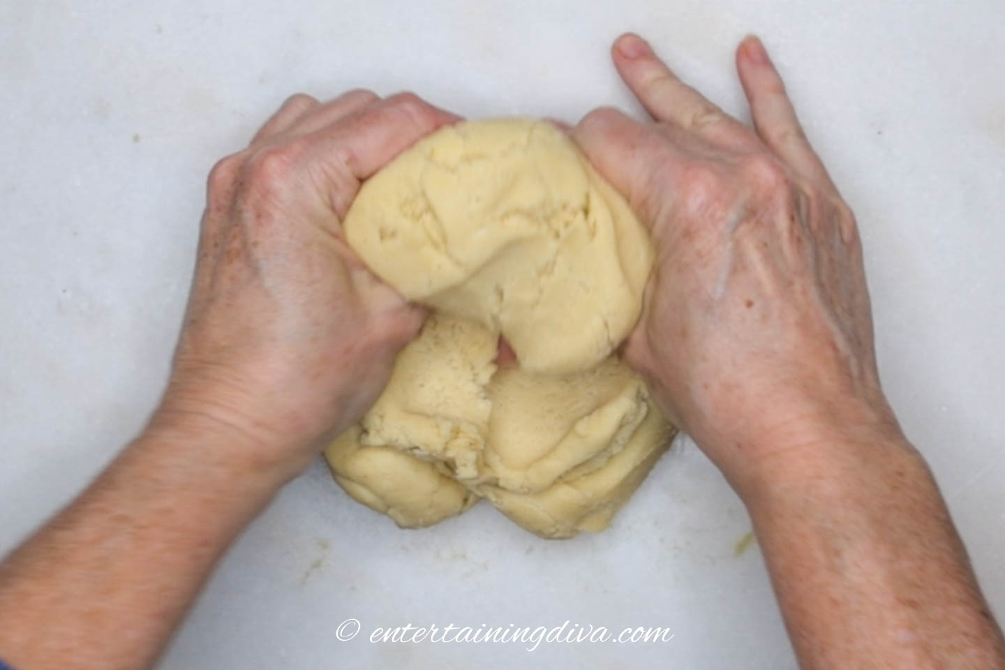 Cookie dough being kneaded