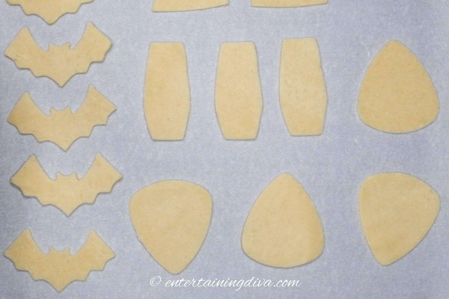 Cut out cookies on a cookie sheet
