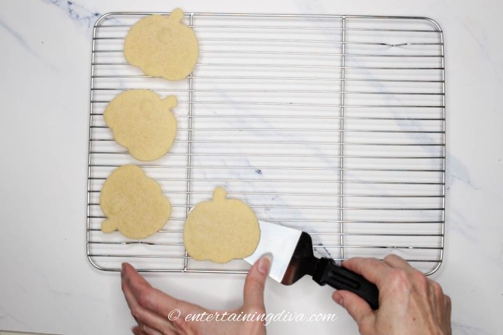 Pumpkin cookies cooling on a wire rack
