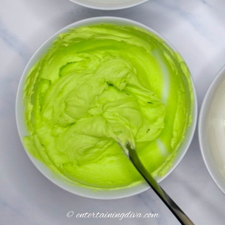 Lime green buttercream icing in a bowl