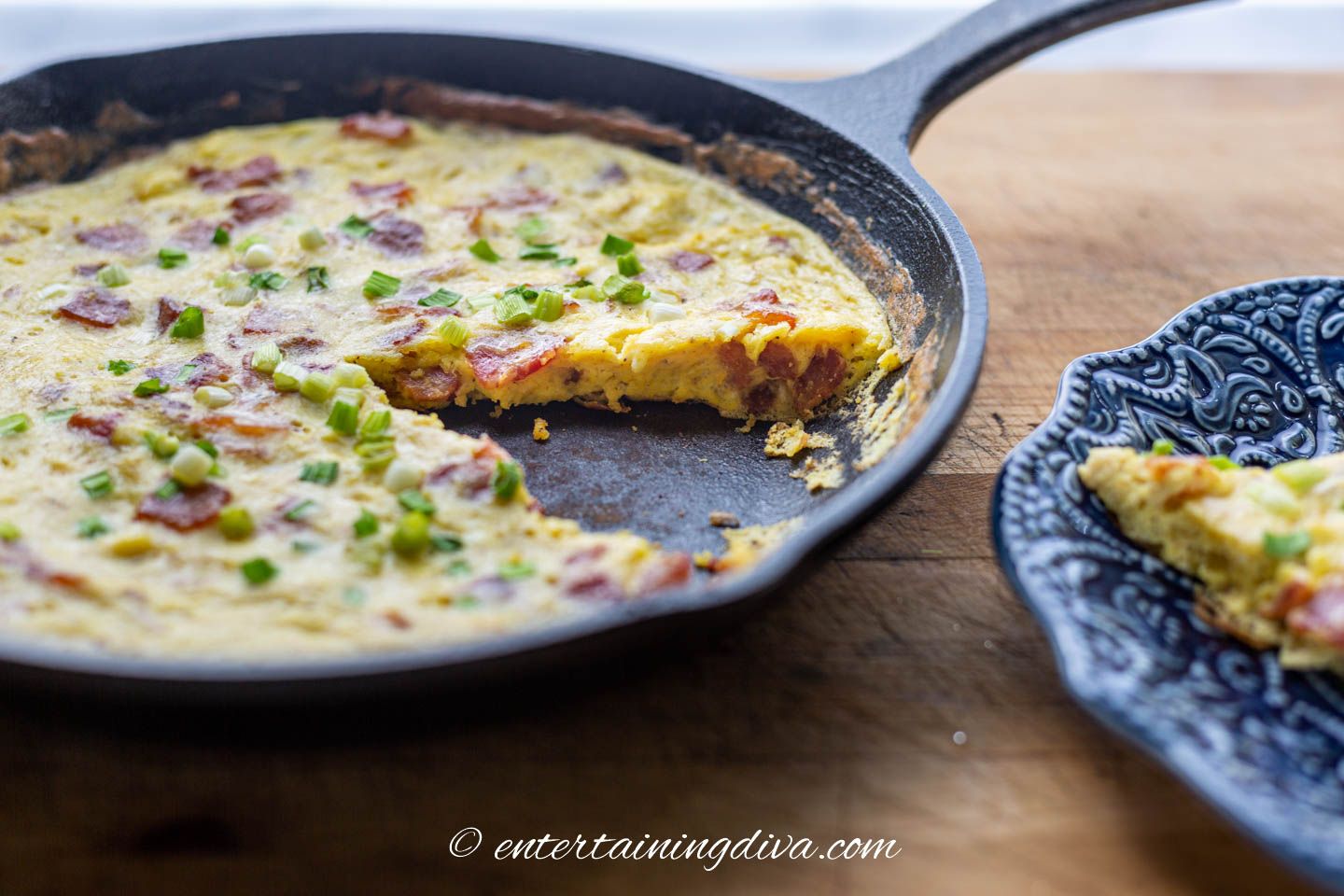 bacon and cheese frittata in a cast irno pan