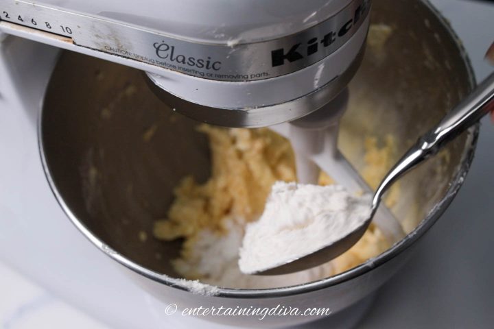 Flour being added to the mixing bowl
