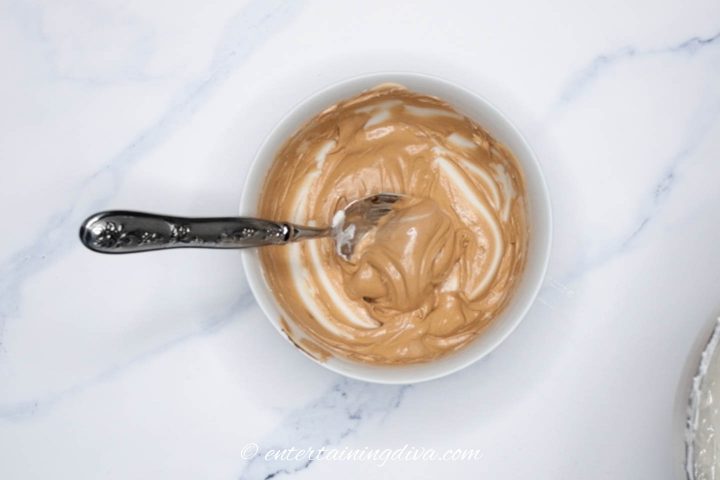 brown royal icing in a bowl