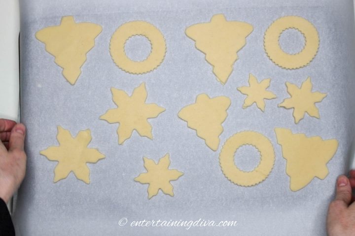 Christmas tree cut out cookies on a cookie sheet