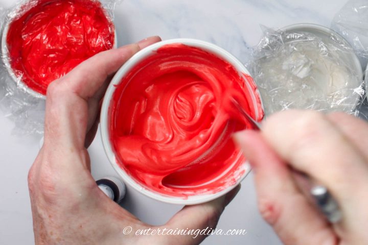 red royal icing in a small bowl