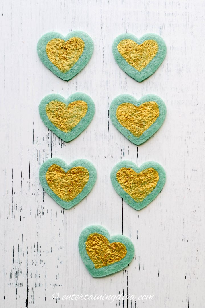Blue heart sugar cookies decorated with gold edible paint