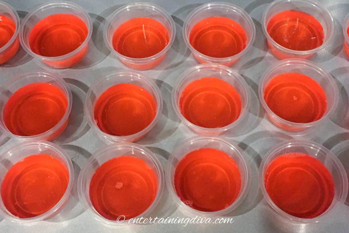Watermelon vodka jelly shots in plastic shot cups