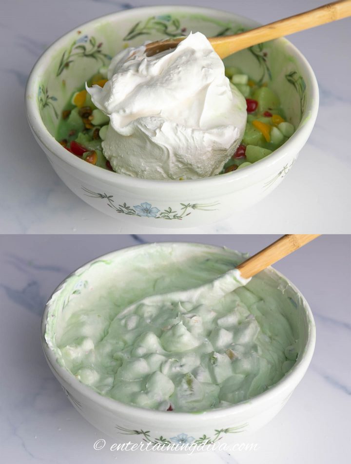 Pistachio fruit salad being made in bowl with Cool Whip