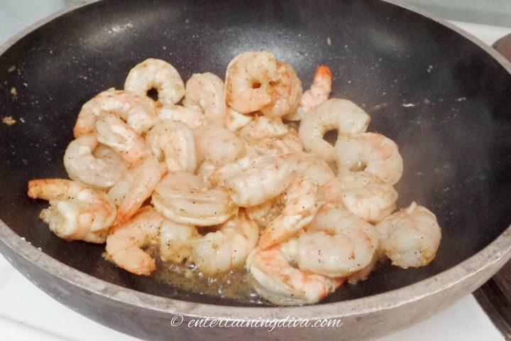 Wok with shrimp being cooked