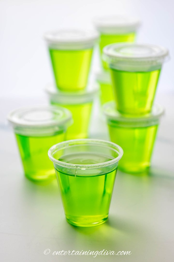 A stack of lime green appletini jello shots