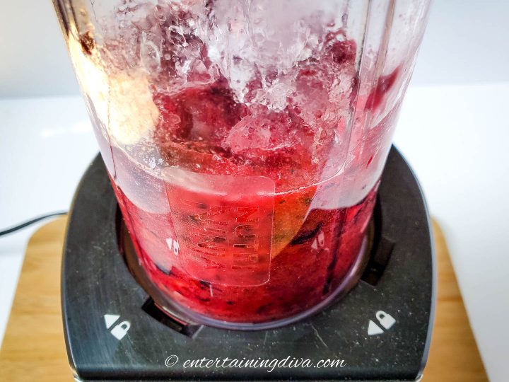 mixed berry margaritas in a blender