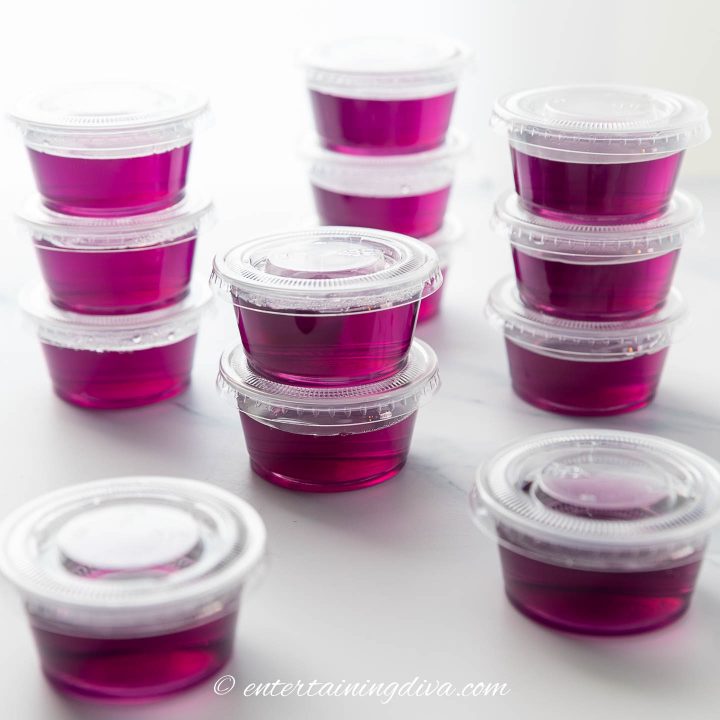 Grape jello shots in jello shot cups with lids