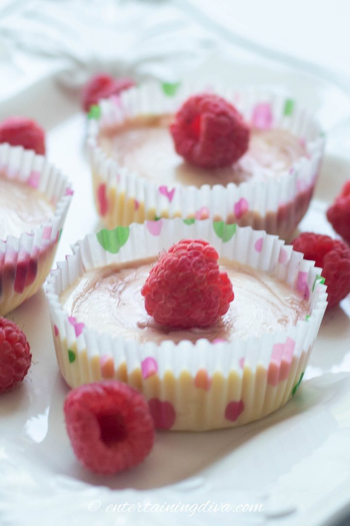Raspberry cheesecake cupcakes with raspberry garnish