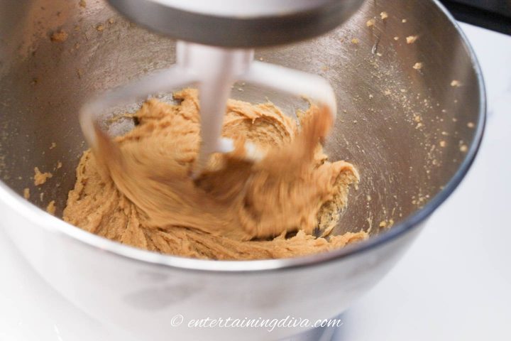 pumpkin spice cake batter in a mixing bowl