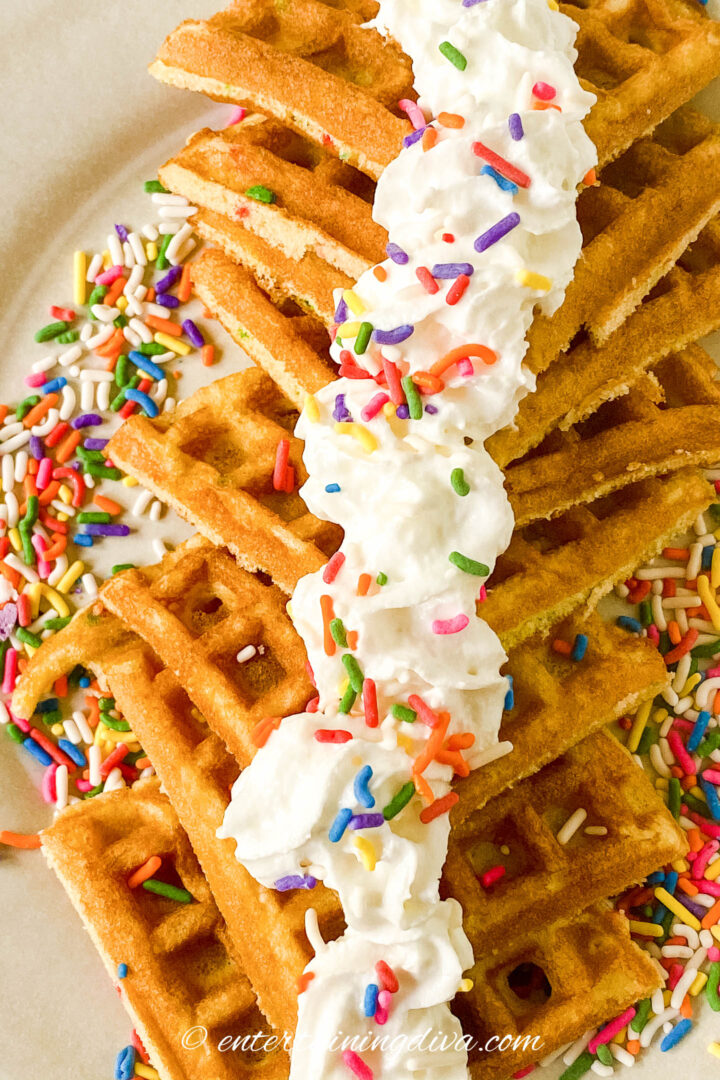 funfetti cake mix waffles with whipped cream and sprinkles