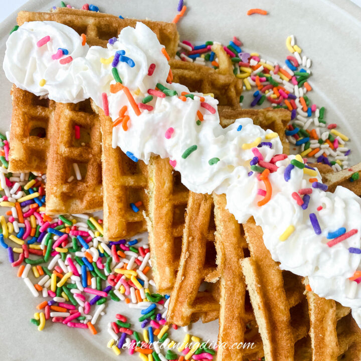 birthday cake waffles with sprinkles and whipped cream