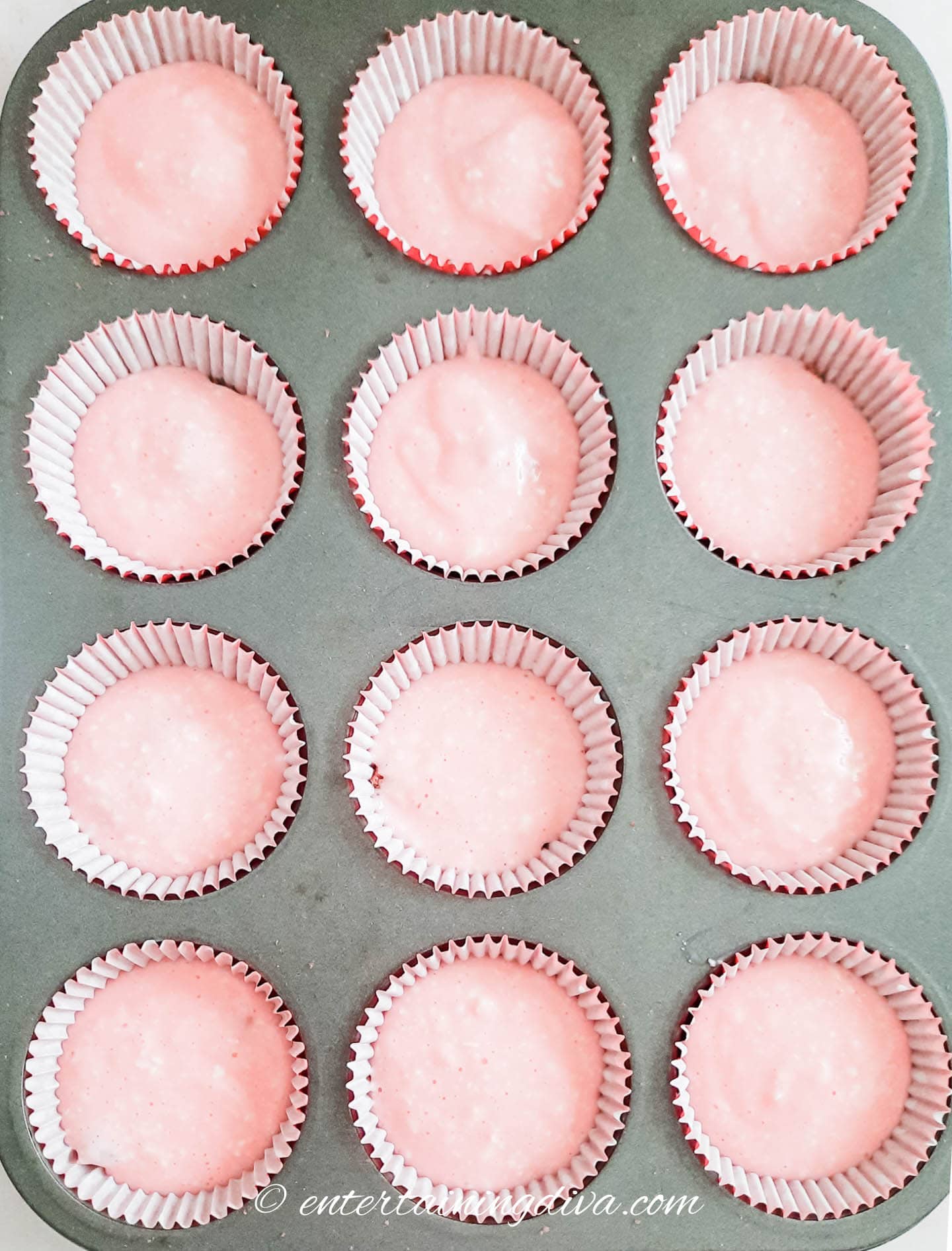 The peppermint cheesecake batter in cupcake tins
